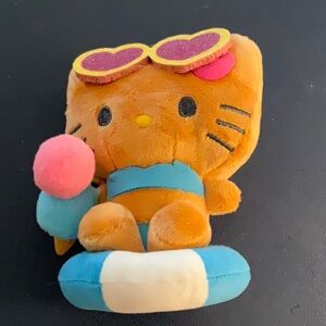 Hello Kitty Plush with life saver sun glasses and ice cream cone.